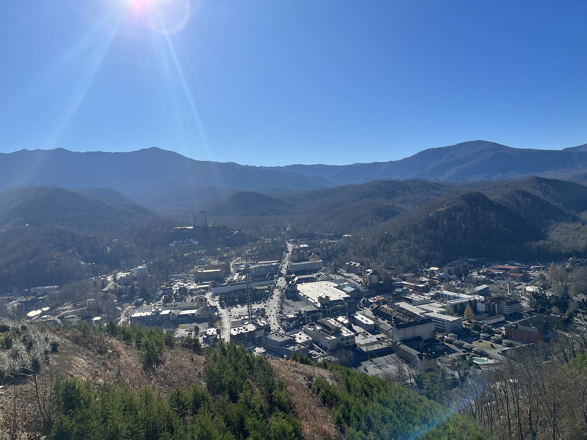 Downtown Gatlinburg, Tennessee, seen from above with the Smoky Mountains behind it